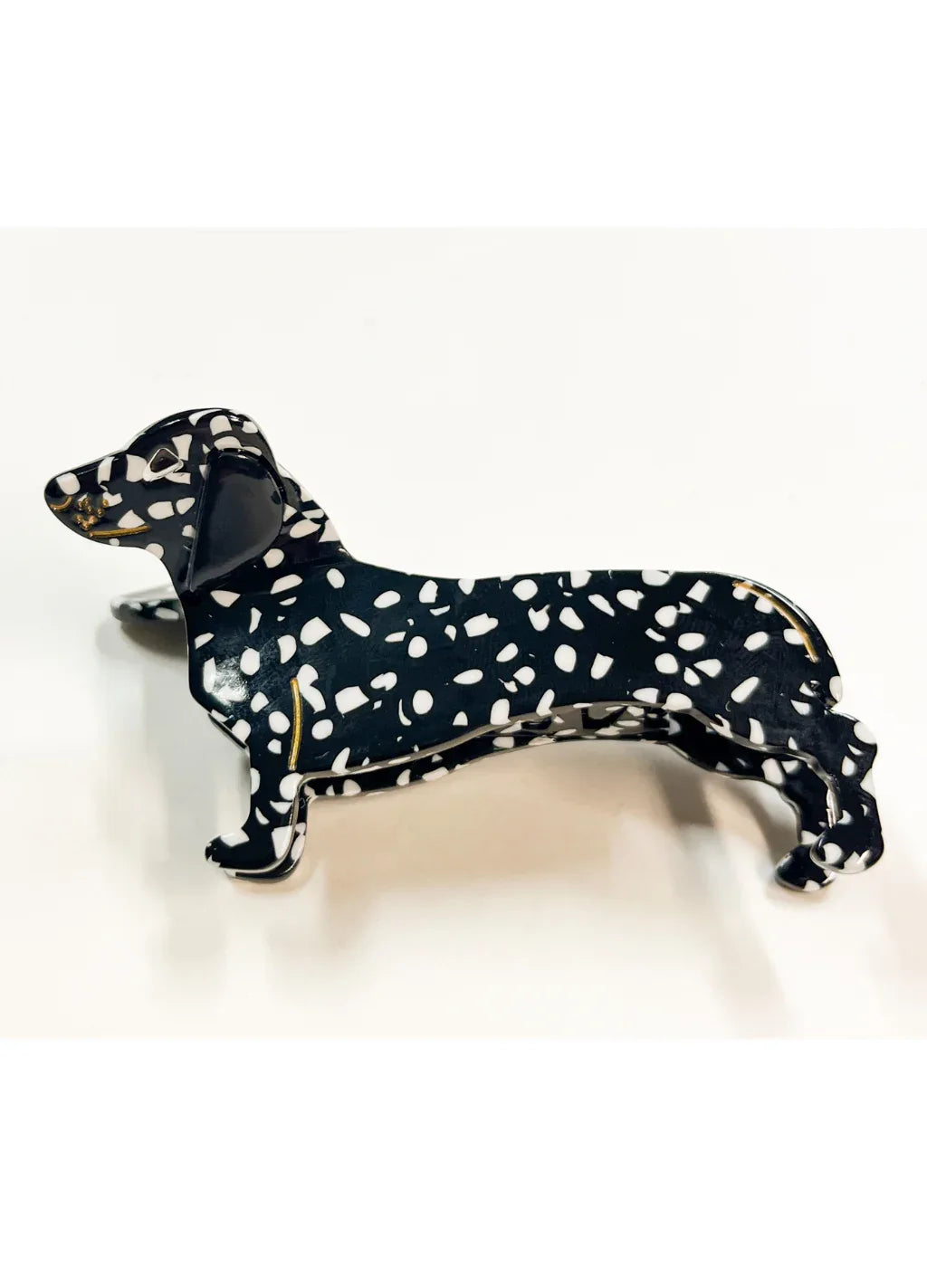 Produktfoto von Haarklammer in Dackelform in der Farbe Schwarz mit weißen Punkten vom Hamburger Modelabel stegmann mode