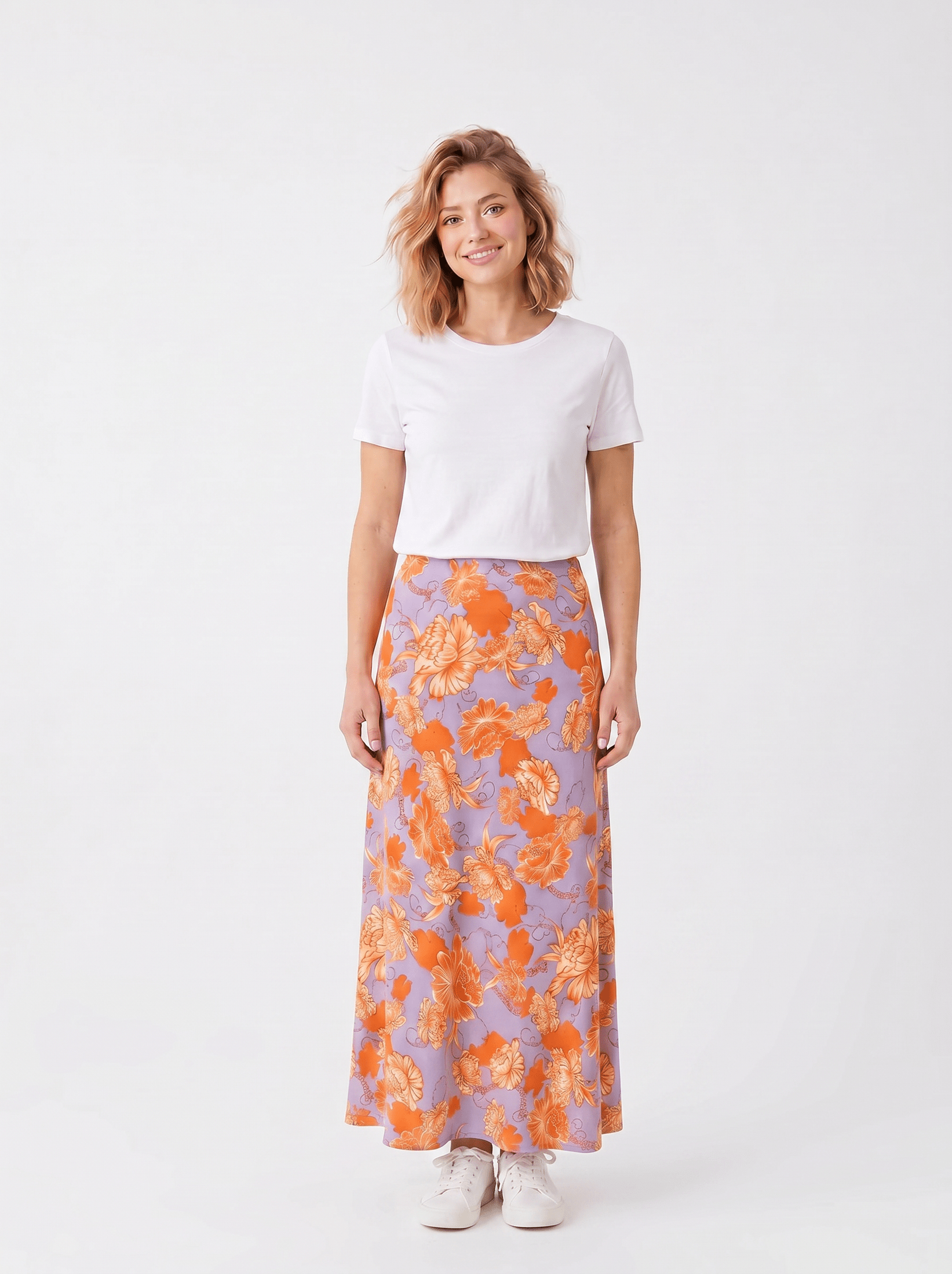 KI generiertes Modell im weißen Studio im Rock Marleen im Print Fleurs Orange vom Hamburger Modelabel stegmann mode