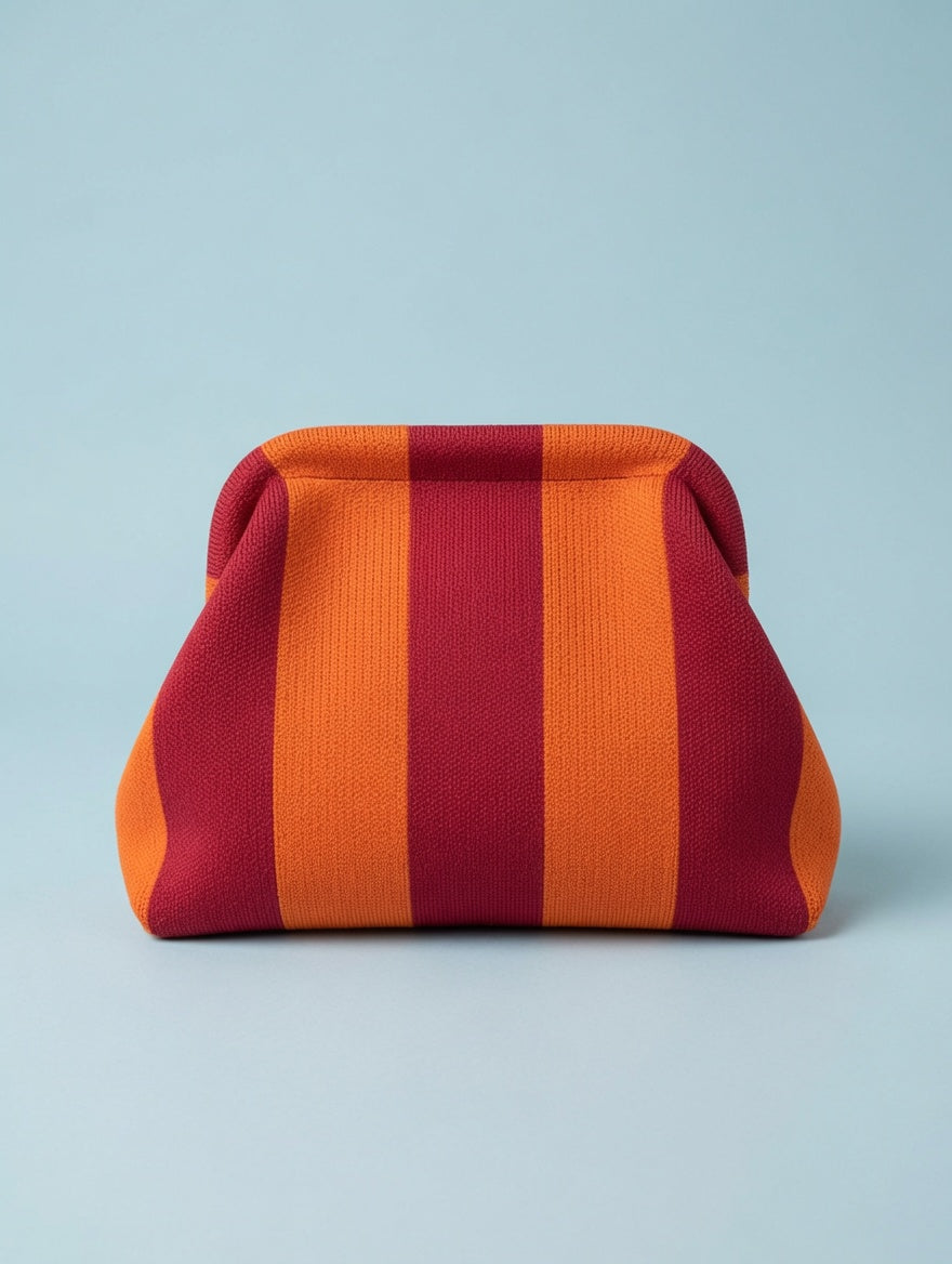 moderne Clutch mit Streifen orange/rot vom Hamburger Modelabel stegmann mode