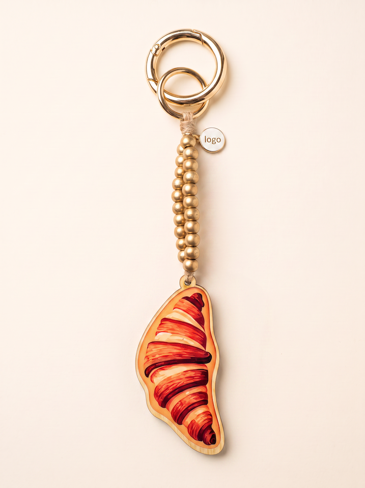 Taschen und Schlüsselanhänger mit Croissant Motiv vom Hamburger Modelabel stegmann mode 